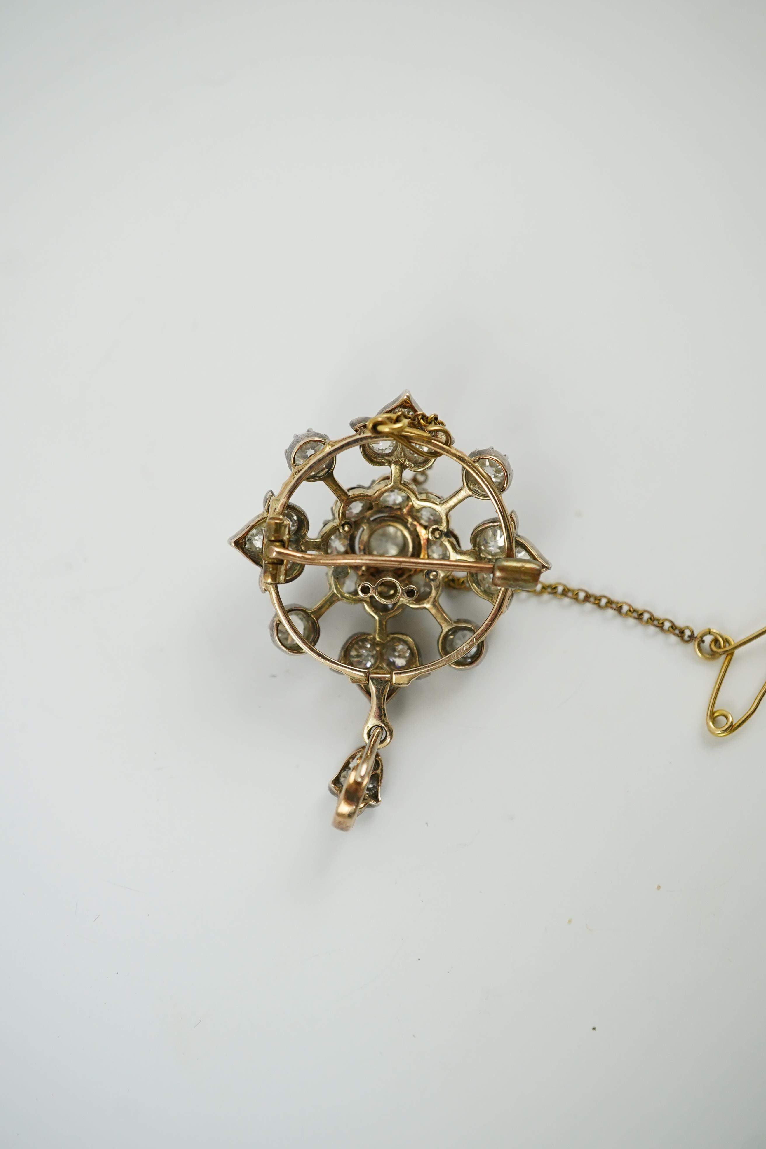 A late Victorian gold, silver and diamond cluster circular pendant brooch